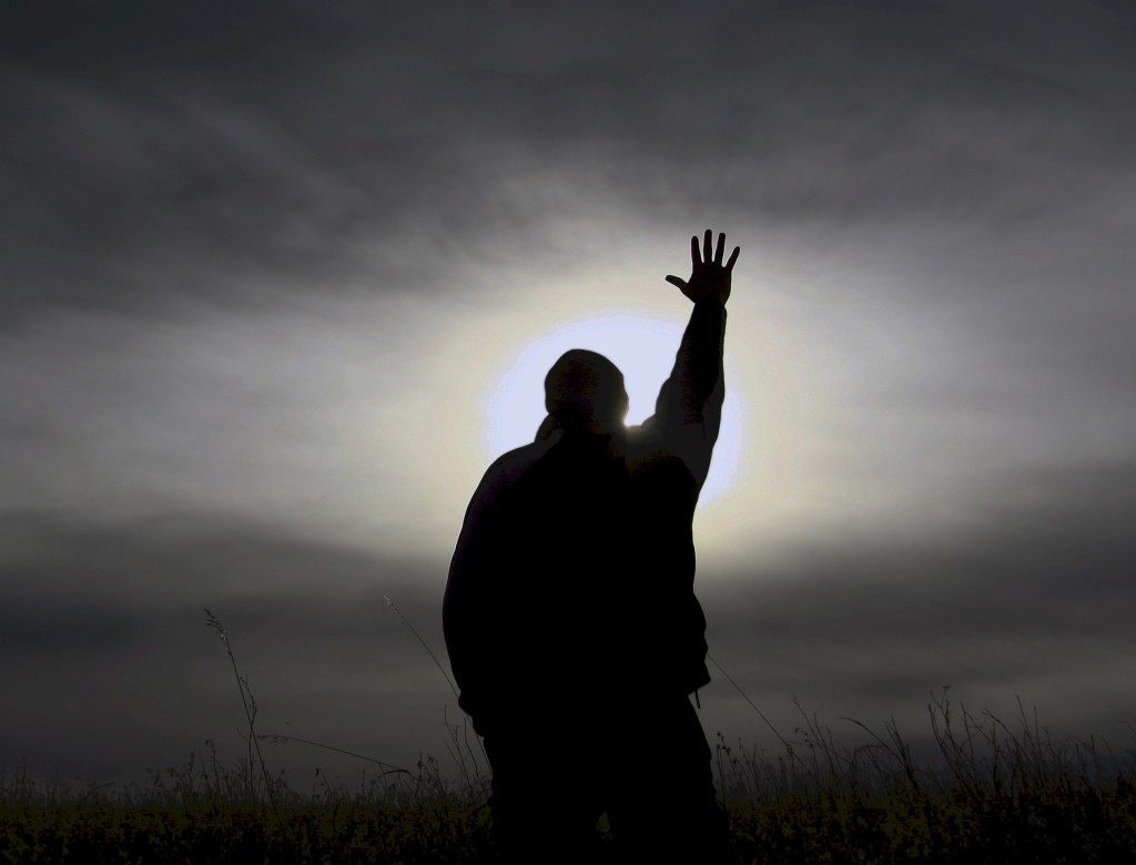 picture of man reaching out to God